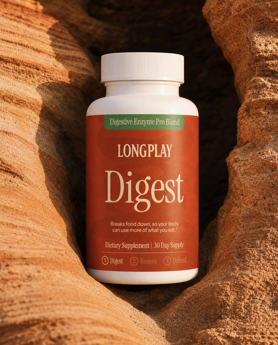 Longplay Digest bottle resting in a warm layered rock formation